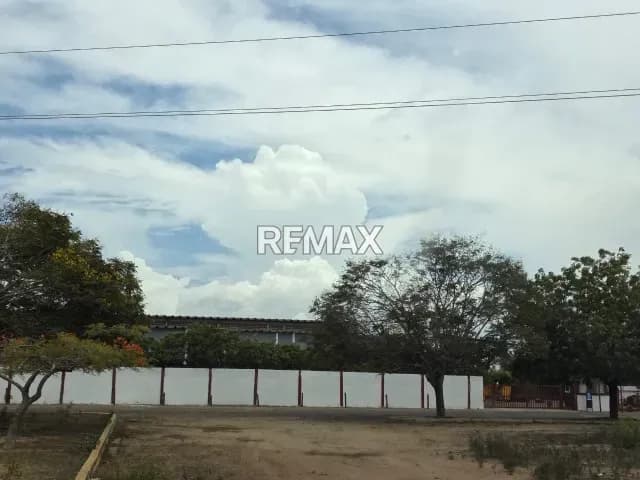 Terreno con Galpón Km 13